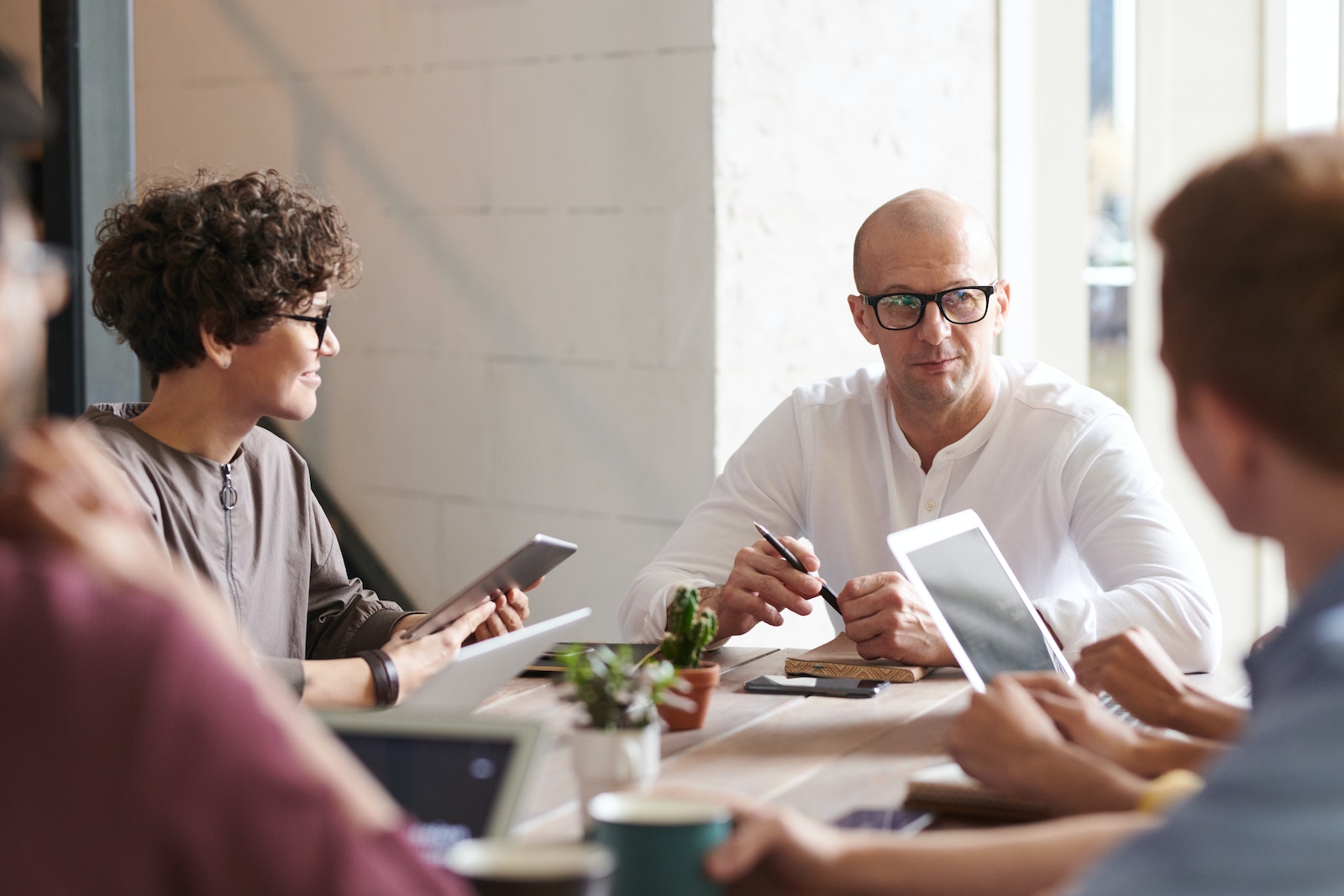 Photo of Man Sitting in Front of People